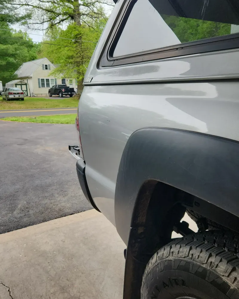 After paintless dent repair: truck bedside dent removed