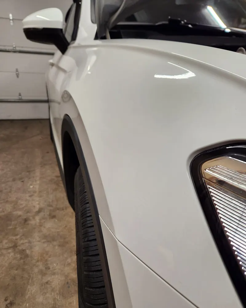 After paintless dent repair: fender dent removed