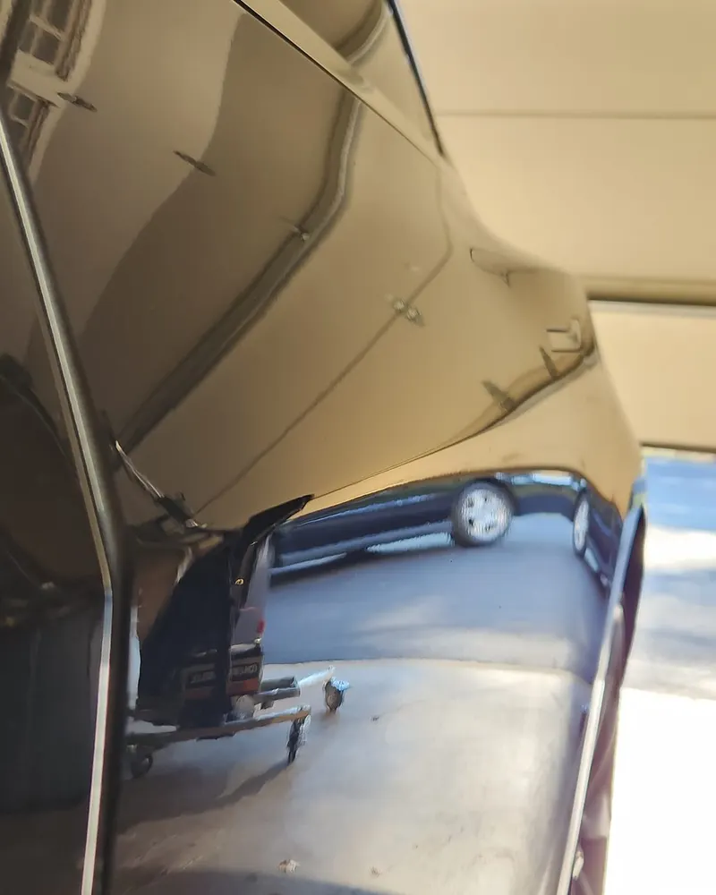 After paintless dent repair: quarter panel dent removed